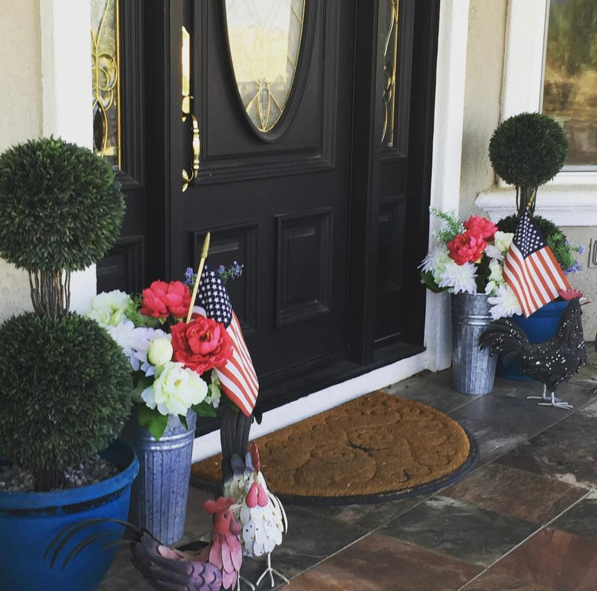 The top photo shows a front door with a door mat, a topiary and red, white and blue flowers on either side